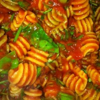 quinoa pasta with red sauce and basil