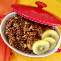 quinoa stuffing for the holidays with kiwi fruit in red pot