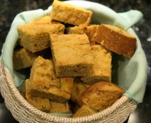 amaranth cornbread in bread basket with teal cloth