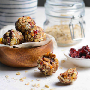 oat bites with cranberries and oats on a table