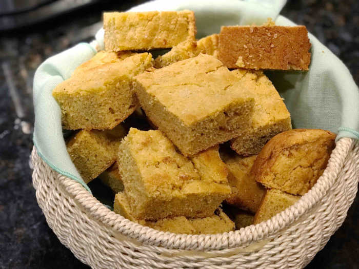 amaranth cornbread in basket with turquoise cloth